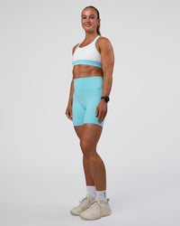 Woman wearing Fusion Ultra High-Rise 6" Short Pockets - Baltic Sea | Model:Sav | Size:S