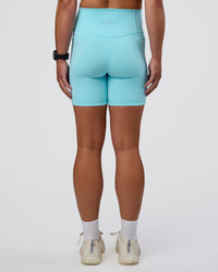 Woman wearing Fusion Ultra High-Rise 6" Short Pockets - Baltic Sea | Set:true | Angle:back | Model:Sav | Size:S