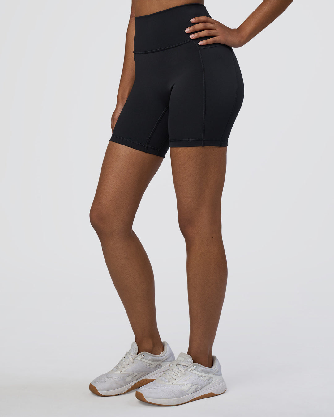 Woman wearing Fusion Ultra High-Rise 6&quot; Short Pockets - Black | Model:Jordan | Size:S