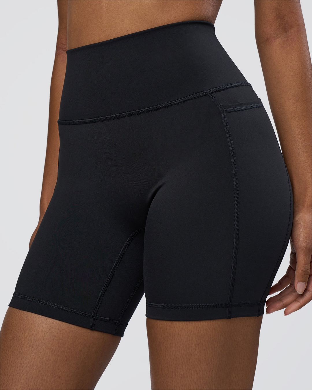 Woman wearing Fusion Ultra High-Rise 6&quot; Short Pockets - Black | Model:Jordan | Size:S