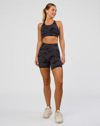 Woman wearing Fusion Ultra High-Rise 6" Short Pockets - Black Tie Dye | Model:Amity | Size:S