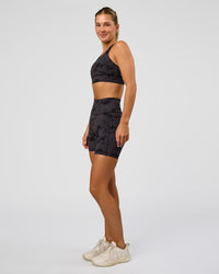 Woman wearing Fusion Ultra High-Rise 6" Short Pockets - Black Tie Dye | Model:Amity | Size:S
