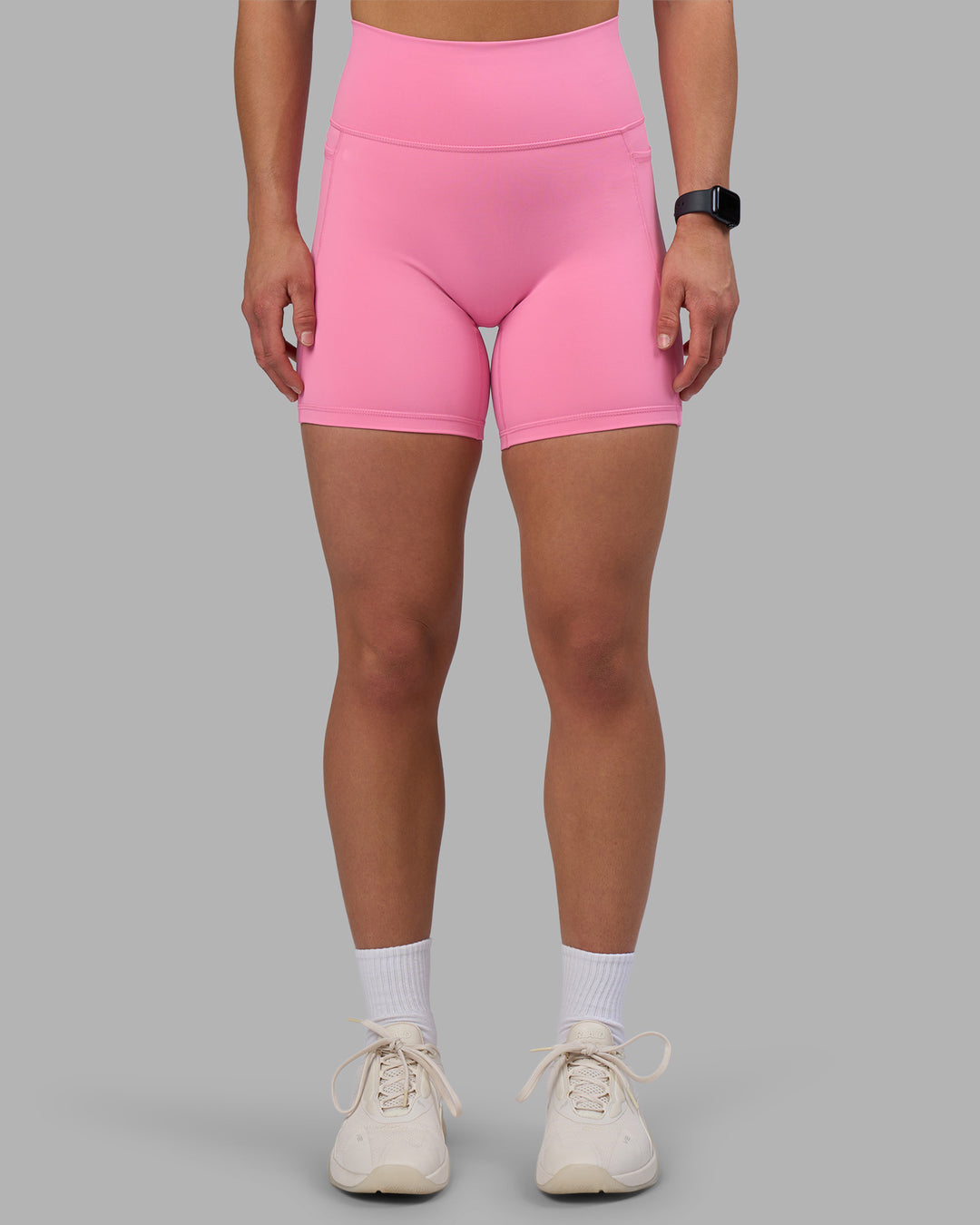 Woman wearing Fusion Ultra High-Rise 6" Short Pockets - Candy Pink | Model:Keisha | Size:S