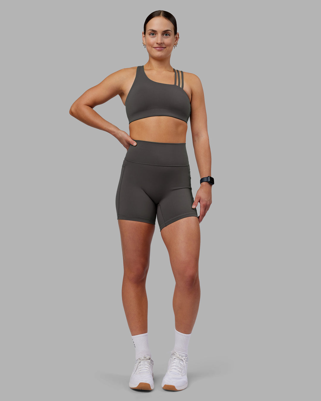 Woman wearing Fusion Ultra High-Rise 6&quot; Short Pockets - Dark Storm | Model:Keisha | Size:S