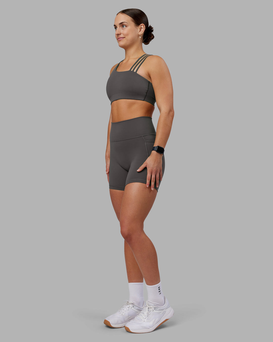 Woman wearing Fusion Ultra High-Rise 6&quot; Short Pockets - Dark Storm | Model:Keisha | Size:S
