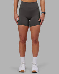 Woman wearing Fusion Ultra High-Rise 6" Short Pockets - Dark Storm | Model:Keisha | Size:S