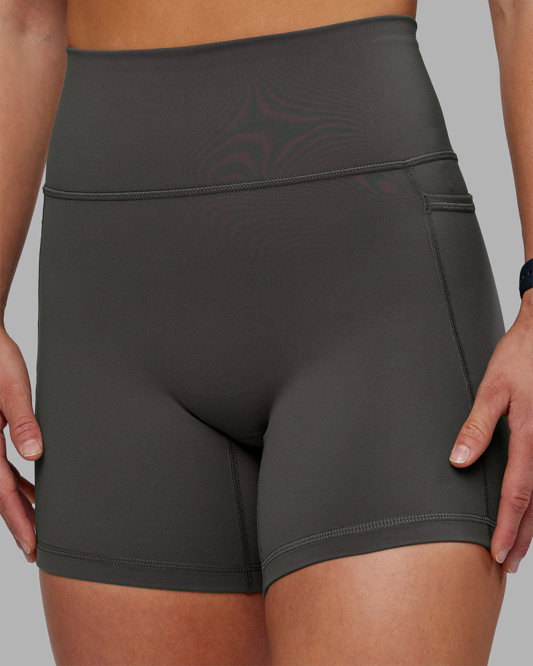 Woman wearing Fusion Ultra High-Rise 6&quot; Short Pockets - Dark Storm | Model:Keisha | Size:S