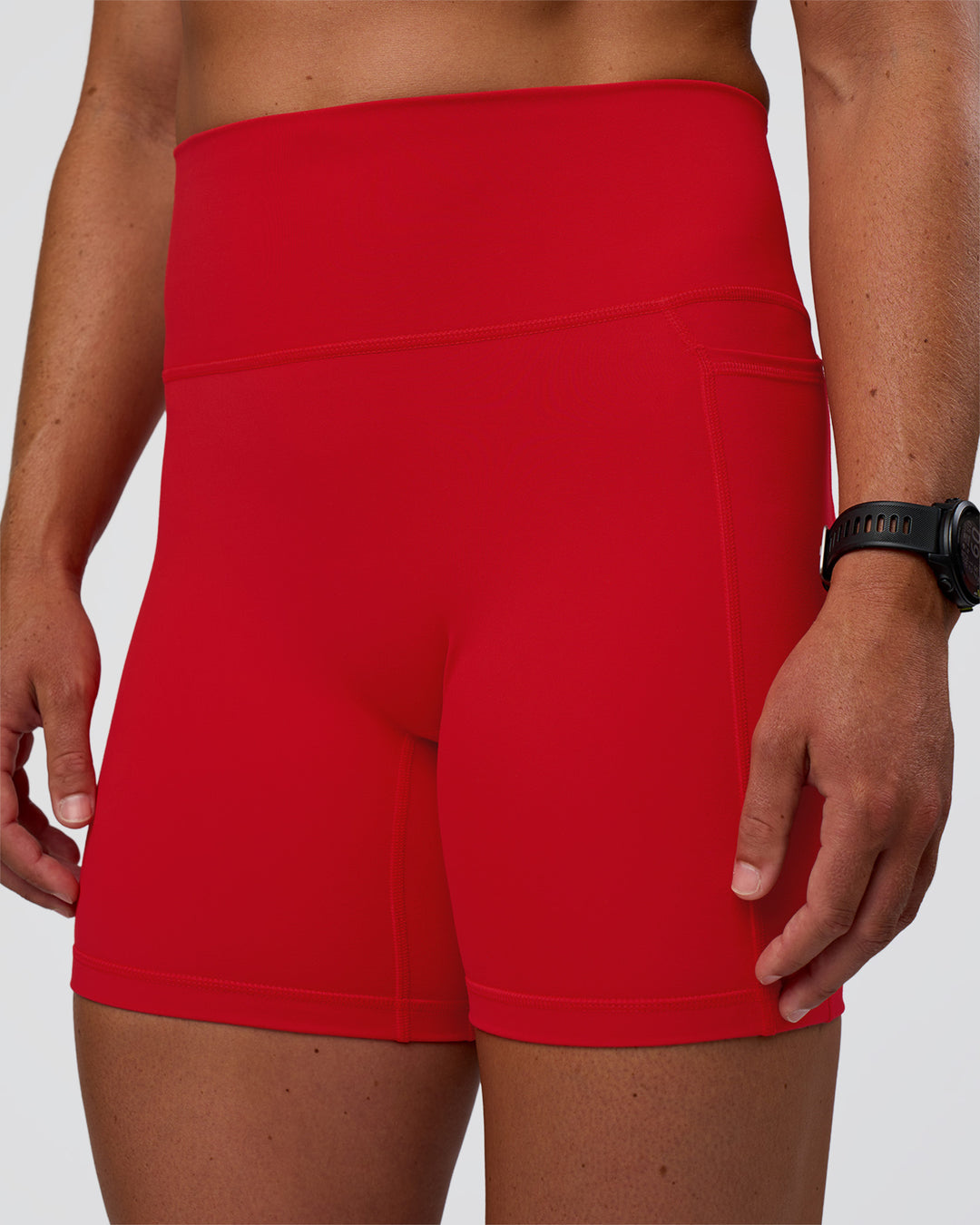 Woman wearing Fusion Ultra High-Rise 6&quot; Short Pockets - Flame | Model:Sav | Size:S