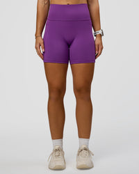 Woman wearing Fusion Ultra High-Rise 6" Short Pockets - Fresh Purple | Set:true | Angle:front | Model:Summer | Size:S