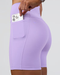Woman wearing Fusion Ultra High-Rise 6" Short Pockets - Pale Lilac | Set:true | Angle:closeup | Model:Emelia | Size:S