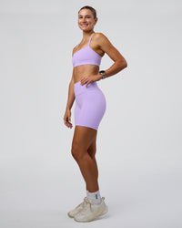 Woman wearing Fusion Ultra High-Rise 6" Short Pockets - Pale Lilac | Model:Emelia | Size:S
