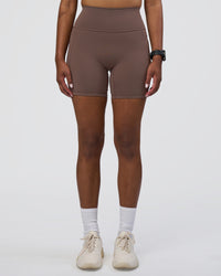 Woman wearing Fusion Ultra High-Rise 6" Short Pockets - Peppercorn | Set:true | Angle:front | Model:Rica | Size:S