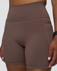 Woman wearing Fusion Ultra High-Rise 6" Short Pockets - Peppercorn | Set:true | Angle:closeup | Model:Rica | Size:S