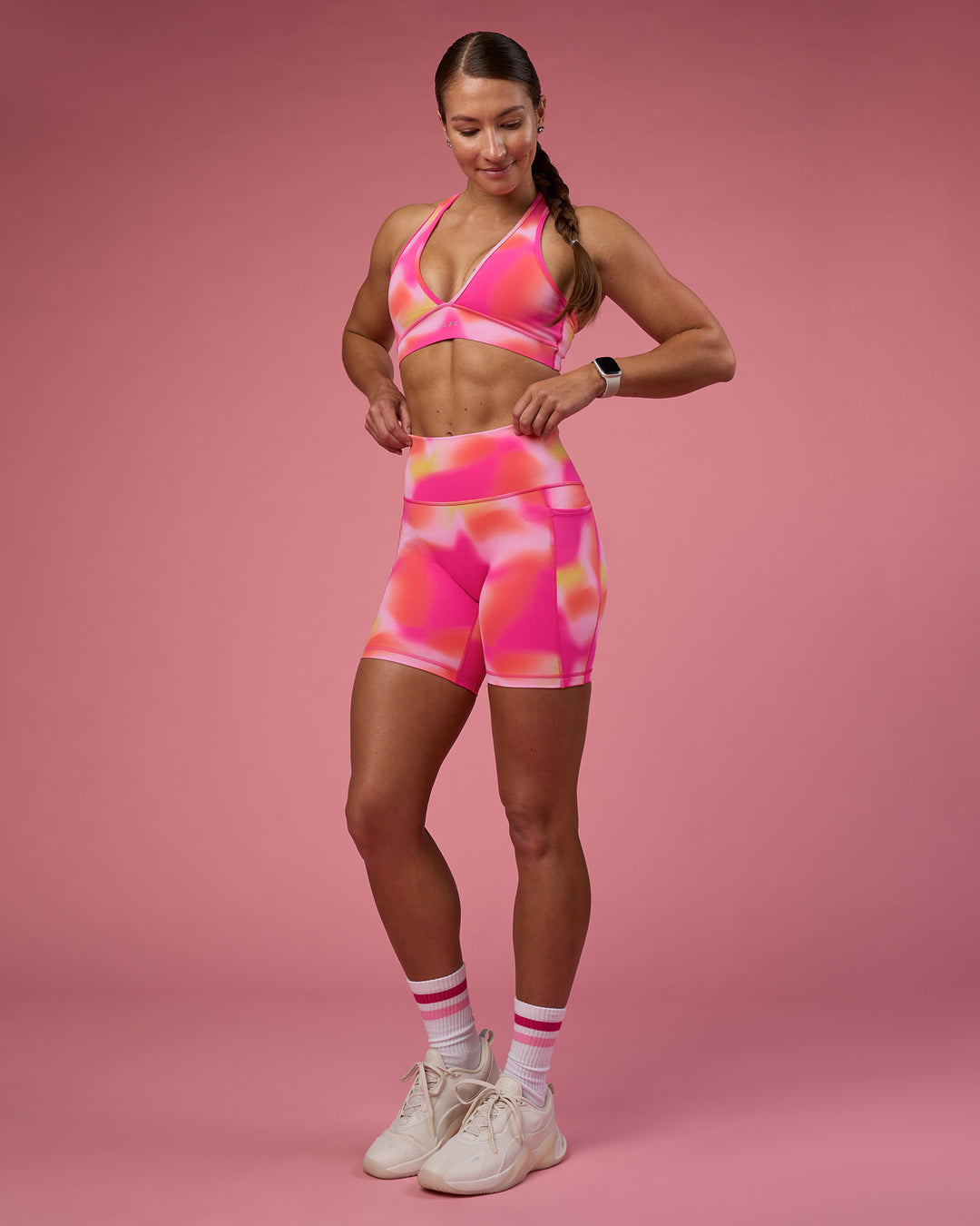 Woman wearing Fusion Ultra High-Rise 6&quot; Short Pockets - Pink Glow Print | Model:Hannah | Size:S