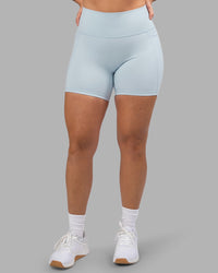 Woman wearing Fusion Ultra High-Rise 6" Short Pockets - Skyride| Model:Robyn | Size:S