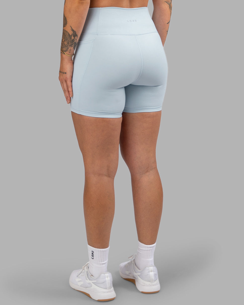 Woman wearing Fusion Ultra High-Rise 6&quot; Short Pockets - Skyride| Model:Robyn | Size:S