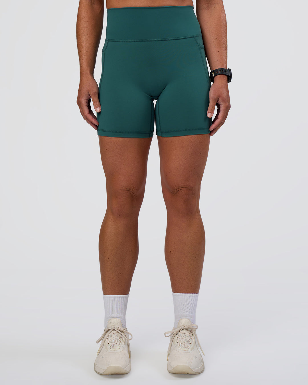Woman wearing Fusion Ultra High-Rise 6" Short Pockets - Transformative Teal | Set:true | Angle:front | Model:Sav | Size:S
