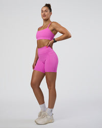 Woman wearing Fusion Ultra High-Rise 6" Short Pockets - Ultra Fuchsia | Model:Abbey | Size:S