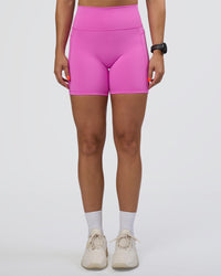 Woman wearing Fusion Ultra High-Rise 6" Short Pockets - Ultra Fuchsia | Set:true | Angle:front | Model:Abbey | Size:S