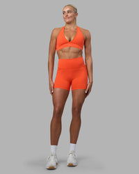 Woman wearing Fusion Ultra High-Rise 6" Short Pockets - Ultra Orange | Model:Katie | Size:S