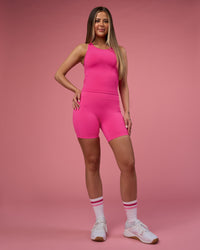 Woman wearing Fusion Ultra High-Rise 6" Short Pockets - Ultra Pink | Model:Tianah | Size:S