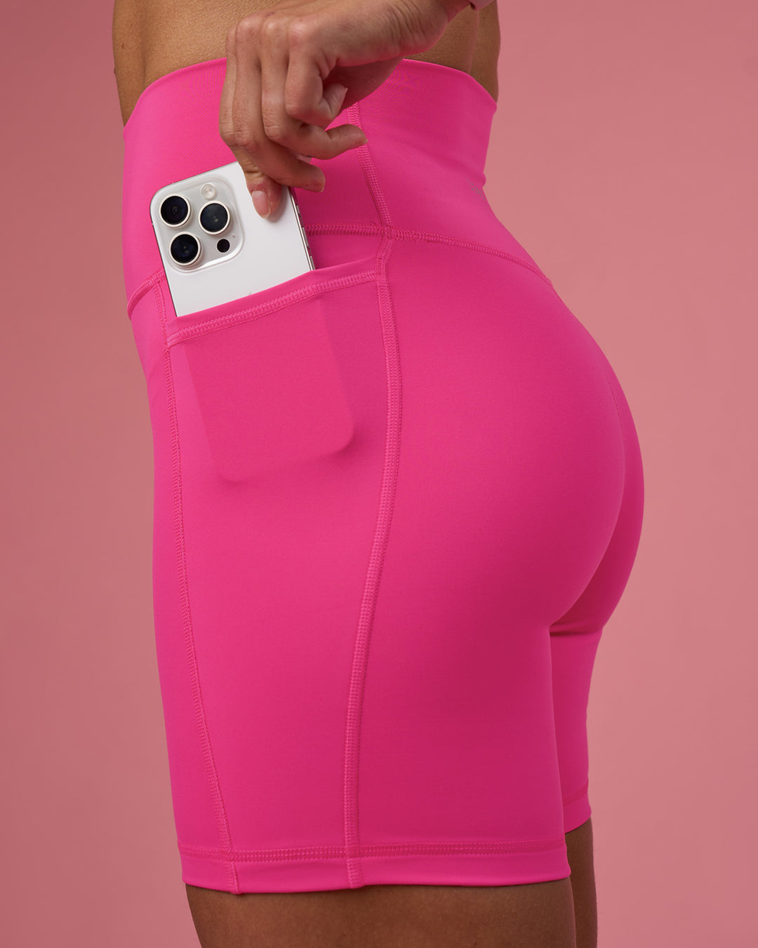 Woman wearing Fusion Ultra High-Rise 6&quot; Short Pockets - Ultra Pink | Model:Hannah | Size:S