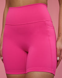 Woman wearing Fusion Ultra High-Rise 6" Short Pockets - Ultra Pink | Model:Hannah | Size:S