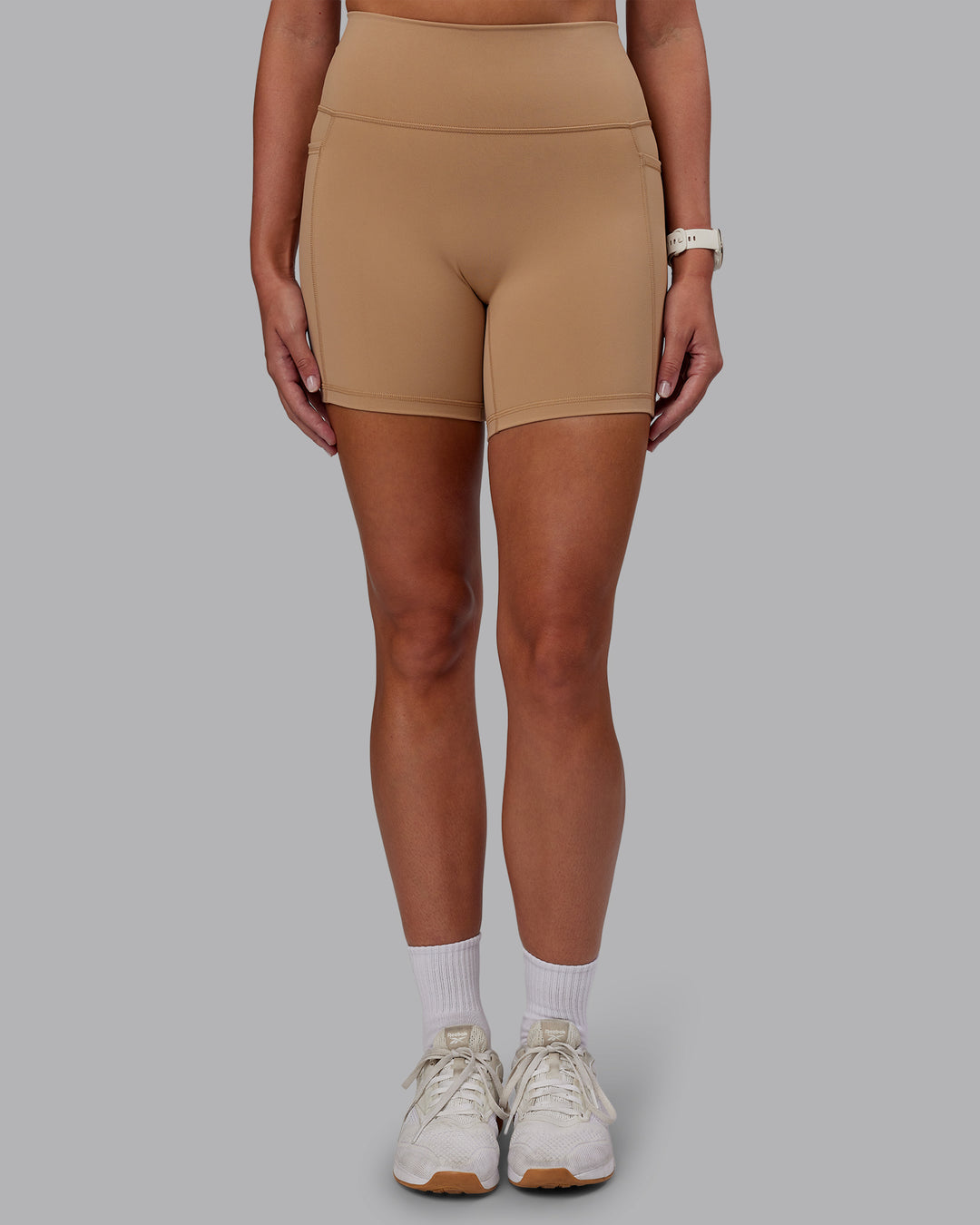 Woman wearing Fusion Ultra High-Rise 6&quot; Short Pockets - Warm Smoke | Model:Phoebe | Size:S