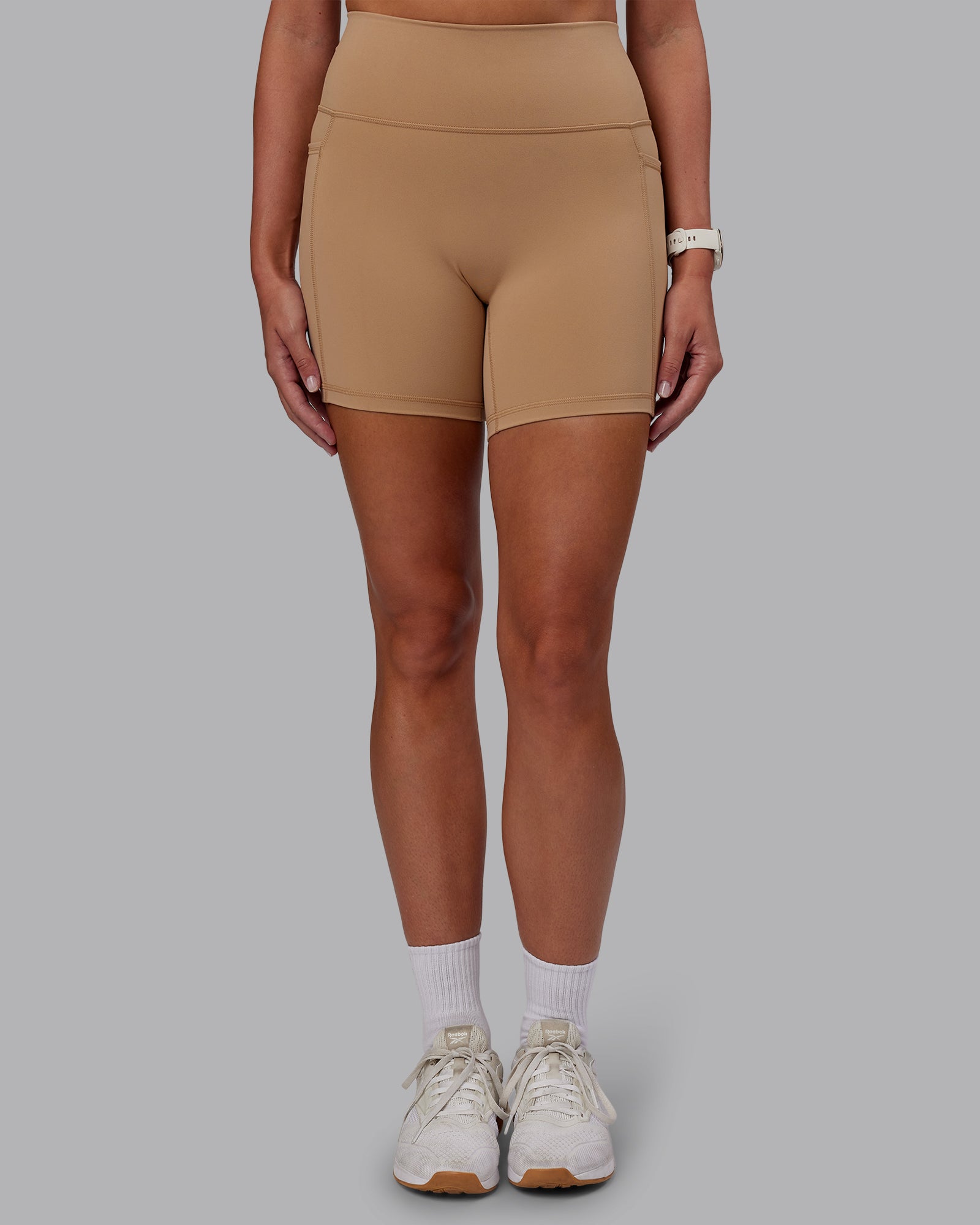 Woman wearing Fusion Ultra High-Rise 6" Short Pockets - Warm Smoke | Model:Phoebe | Size:S