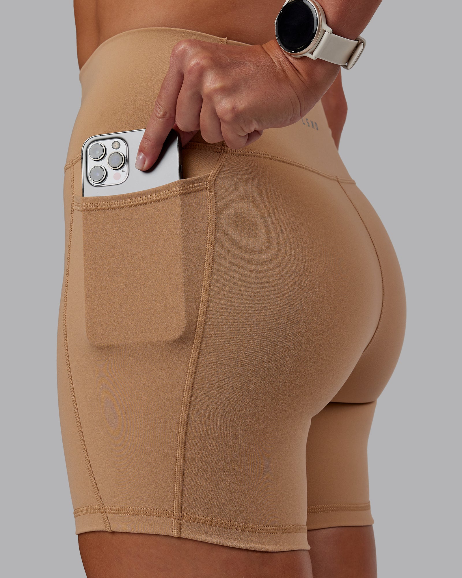 Woman wearing Fusion Ultra High-Rise 6" Short Pockets - Warm Smoke | Model:Phoebe | Size:S