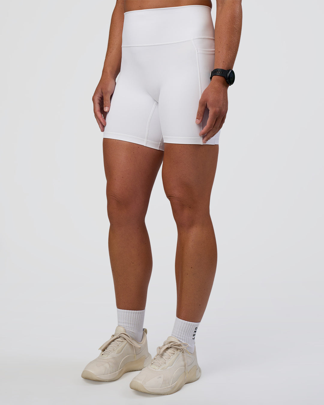 Woman wearing Fusion Ultra High-Rise 6" Short Pockets - White | Model:Sav | Size:S