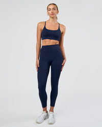 Woman wearing Fusion Ultra High-Rise 7/8 Legging - Future Navy | Model:Evie | Size:S