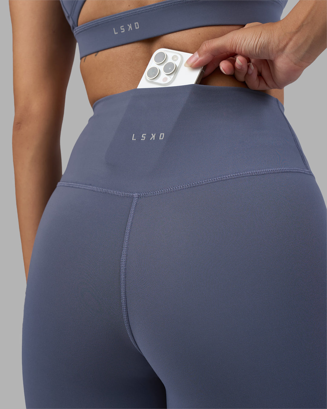 Woman wearing Fusion Ultra High-Rise 7/8 Legging - Night Shadow | Model:Rhiley | Size:S