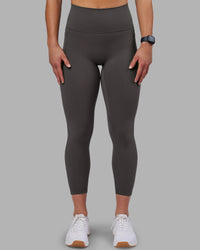 Woman wearing Fusion Ultra High-Rise 7/8 Legging Pockets - Dark Storm | Model:Keisha | Size:S