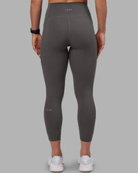 Woman wearing Fusion Ultra High-Rise 7/8 Legging Pockets - Dark Storm | Model:Keisha | Size:S
