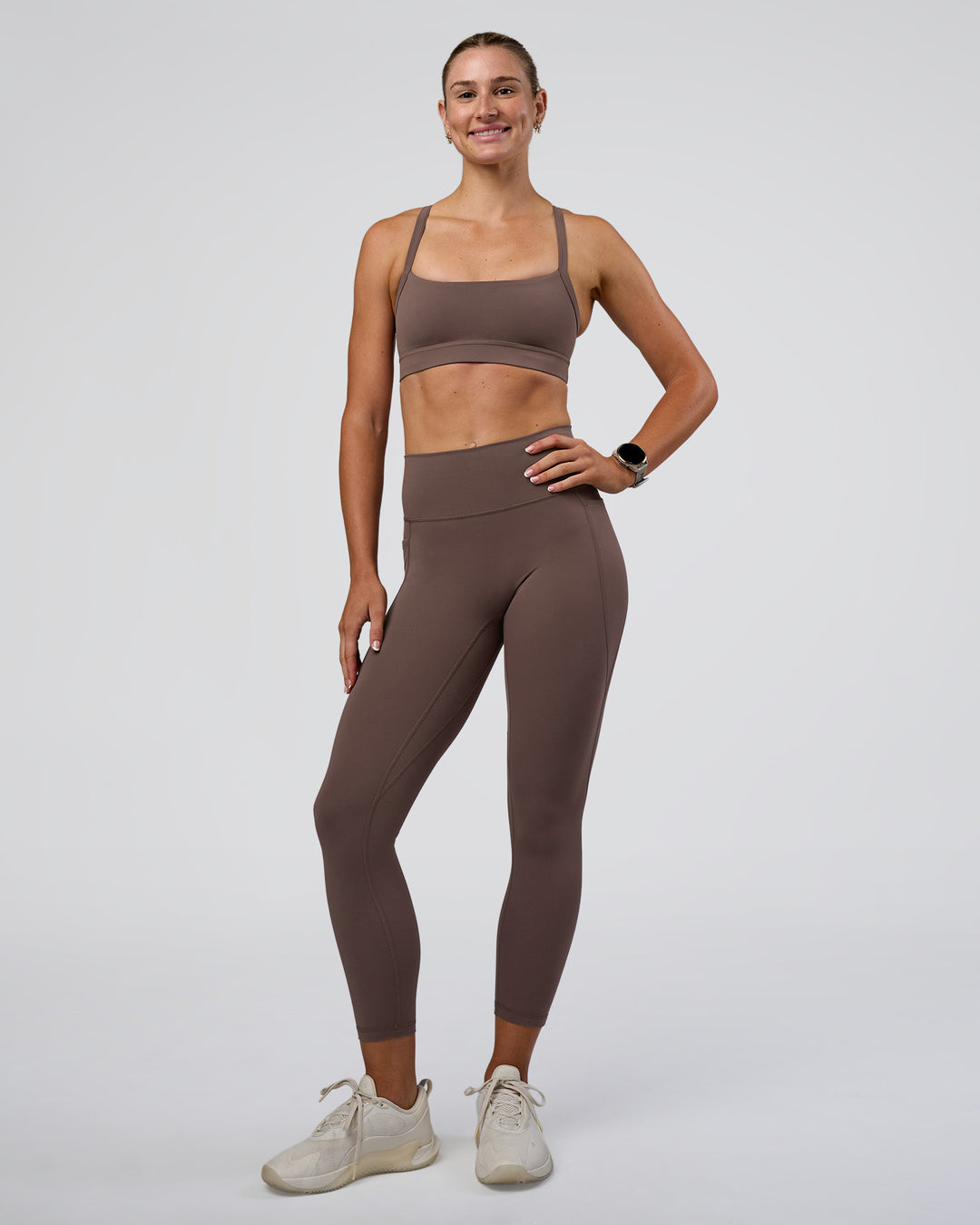 Woman wearing Fusion Ultra High-Rise 7/8 Legging Pockets - Peppercorn | Model:Emelia | Size:S