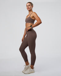 Woman wearing Fusion Ultra High-Rise 7/8 Legging Pockets - Peppercorn | Model:Emelia | Size:S