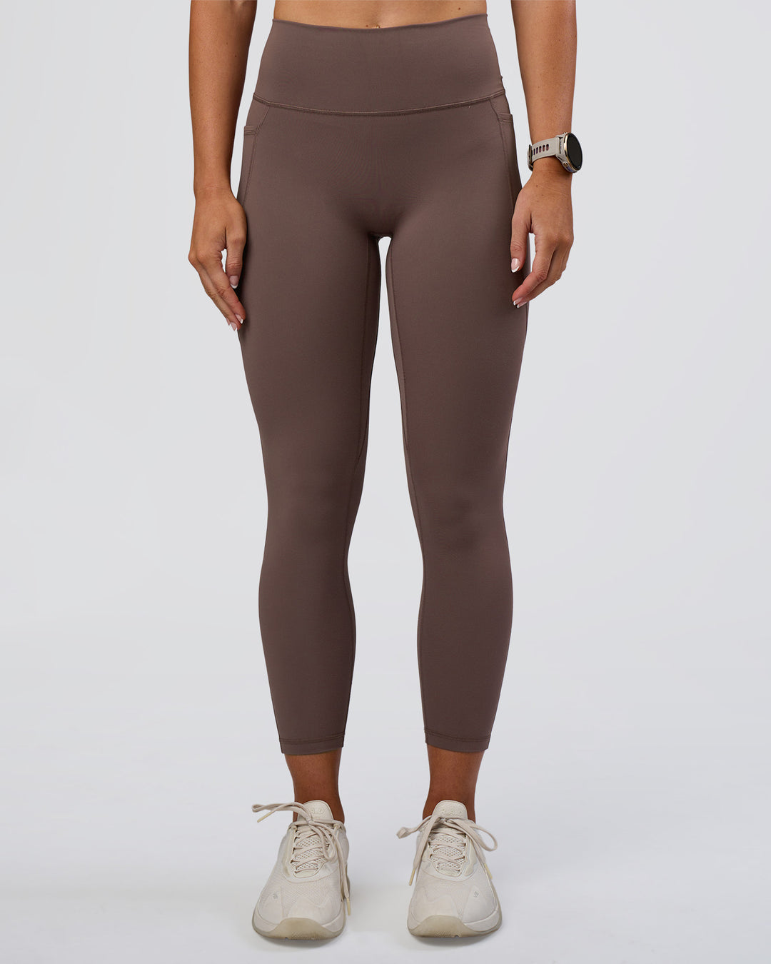Woman wearing Fusion Ultra High-Rise 7/8 Legging Pockets - Peppercorn | Model:Emelia | Size:S