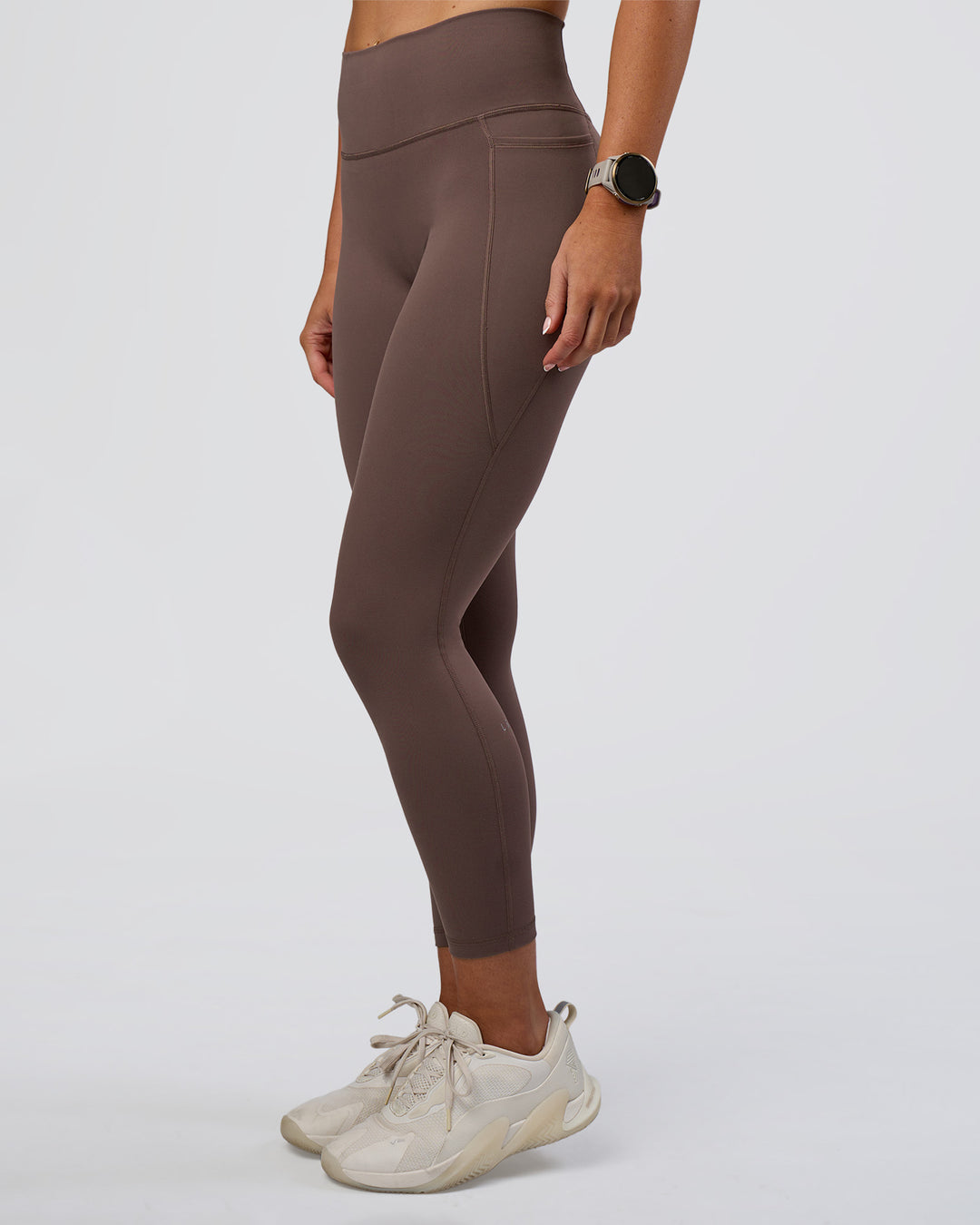 Woman wearing Fusion Ultra High-Rise 7/8 Legging Pockets - Peppercorn | Model:Emelia | Size:S