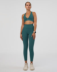 Woman wearing Fusion Ultra High-Rise 7/8 Legging Pockets - Transformative Teal | Model:Myrte | Size:S