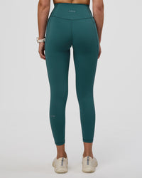  Woman wearing Fusion Ultra High-Rise 7/8 Legging Pockets - Transformative Teal | Model:Myrte | Size:S