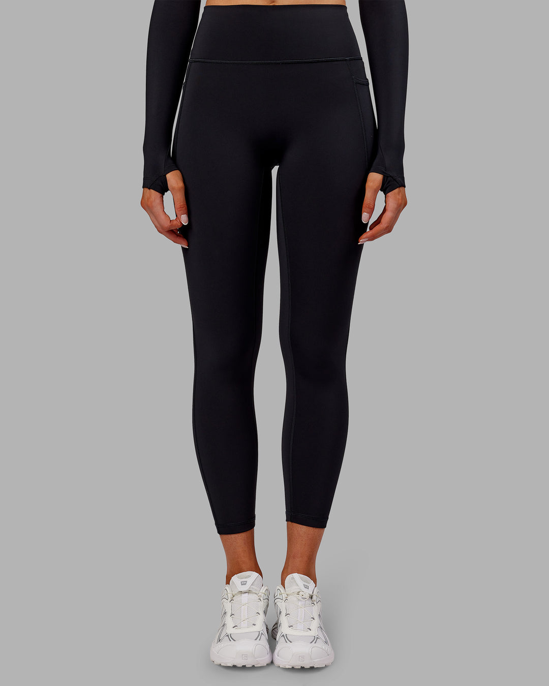 Woman wearing Fusion Ultra High-Rise 7/8 Thermal Legging Pockets - Black | Model:Ella | Size:S