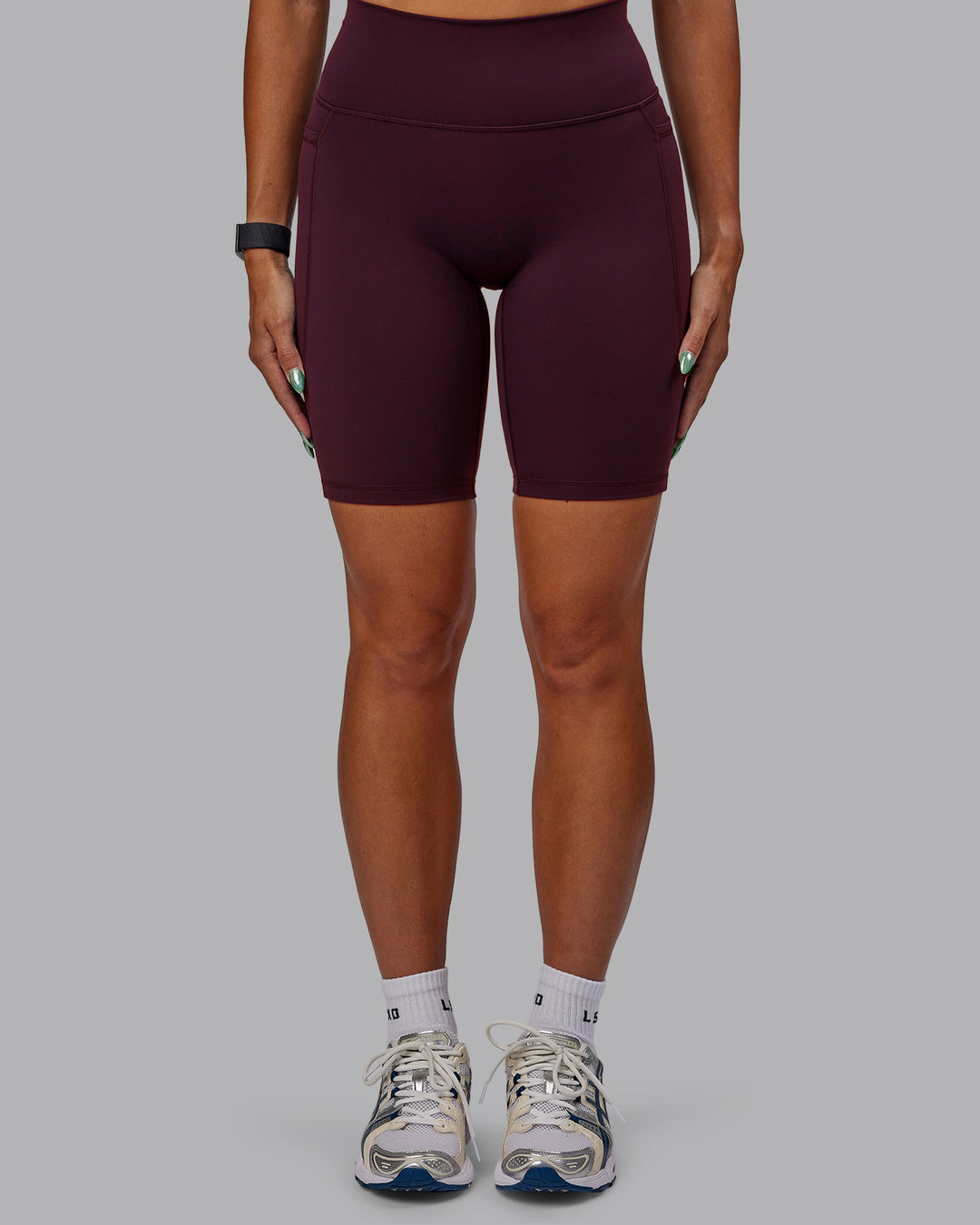 Woman wearing Fusion Ultra High-Rise 9&quot; Short Pockets - Cherry Lacquer | Model:Vanessa | Size:S