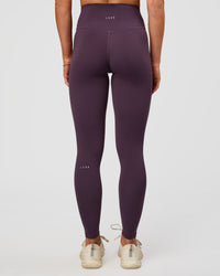 Woman wearing Fusion Ultra High-Rise Full Length Legging - Midnight Plum | Model:Emelia | Size:S