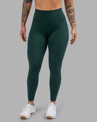 Woman wearing Fusion Ultra High-Rise Full Length Legging Pockets - Dark Moss | Model:Robyn | Size:S