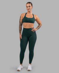 Woman wearing Fusion Ultra High-Rise Full Length Legging Pockets - Dark Moss | Model:Robyn | Size:S
