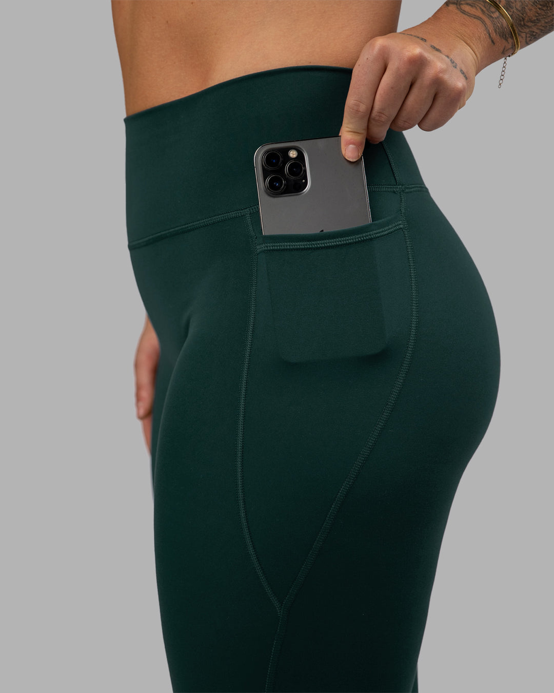Woman wearing Fusion Ultra High-Rise Full Length Legging Pockets - Dark Moss | Model:Robyn | Size:S