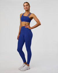 Woman wearing Fusion Ultra High-Rise Full Length Legging Pockets - Electric Indigo | Model:Evie | Size:S