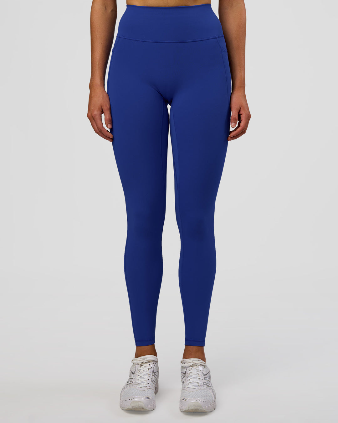 Woman wearing Fusion Ultra High-Rise Full Length Legging Pockets - Electric Indigo | Model:Evie | Size:S