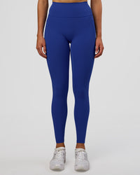 Woman wearing Fusion Ultra High-Rise Full Length Legging Pockets - Electric Indigo | Model:Evie | Size:S